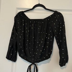 Cute off the shoulder black and gold blouse.